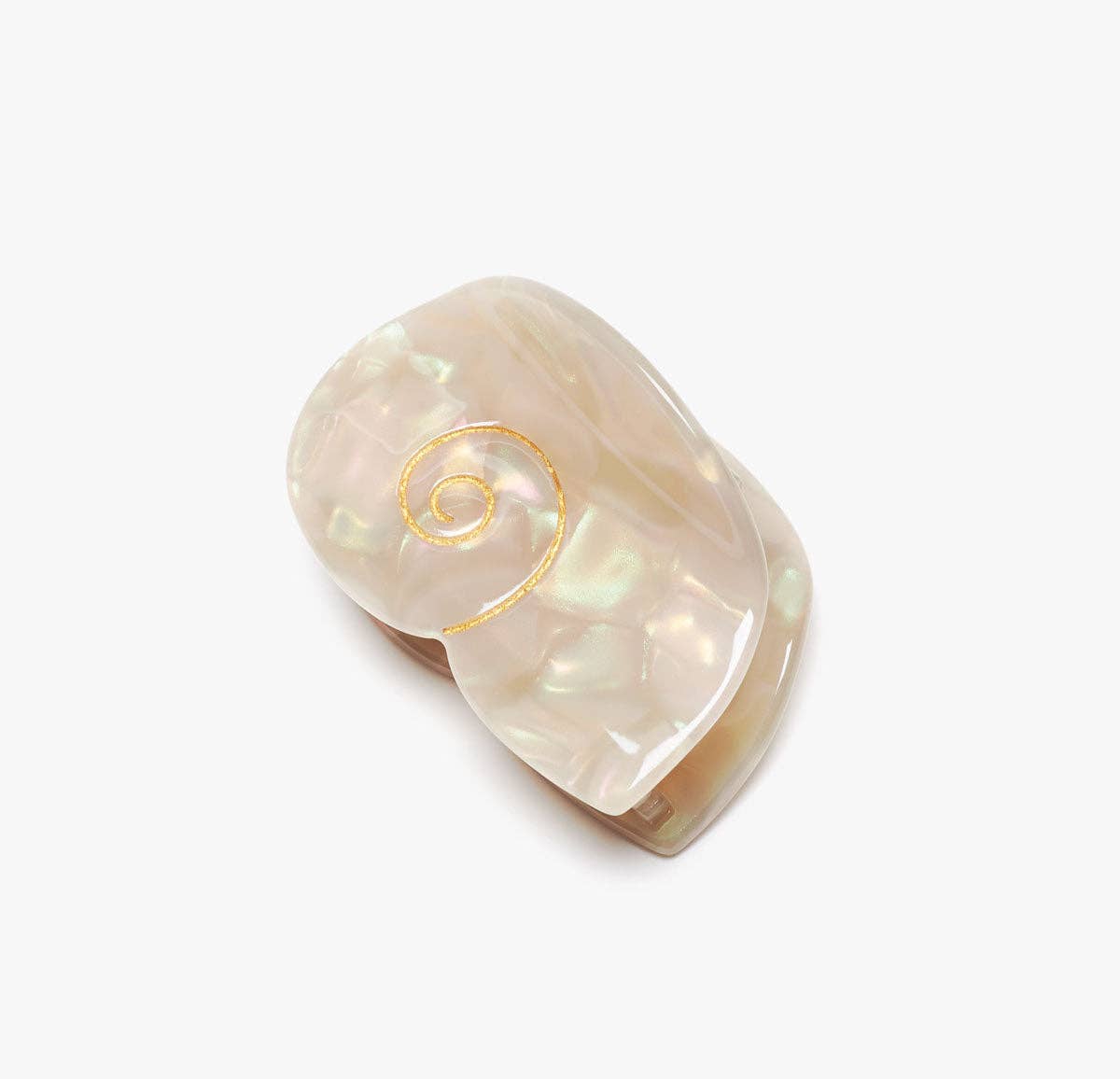 The Siren Hair Claw features a shimmering shell-inspired design with a pearlescent finish and delicate gold spiral detail, crafted from cellulose acetate.